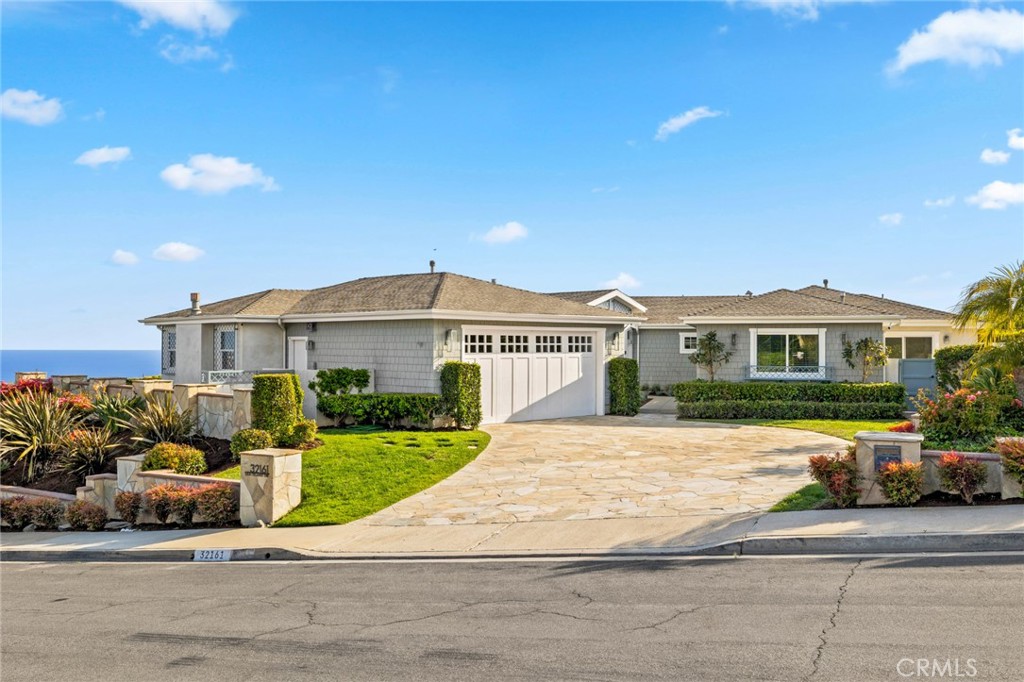 Welcome to this single-level remodeled contemporary home located in prestigious Monarch Bay Terrace. The stunning residence offers sweeping views of the Pacific Ocean, Waldorf Astoria resort, and radiant city lights, providing a tranquil and scenic backdrop to everyday living. Featuring three spacious bedrooms and three and one-half luxurious baths, every corner of this home is adorned with elegant finishes that exude sophistication and style. The modern chef’s kitchen is a culinary dream. It is equipped with top-of-the-line stainless steel appliances and seamlessly connected to the family room, making it perfect for entertaining and family gatherings. Wide plank oak floors flow throughout the living spaces, adding warmth and elegance to the contemporary design. Large windows and sliding doors invite natural light and coastal breezes, creating an airy and bright atmosphere. The primary suite is a private retreat with breathtaking ocean views, a spa-like bath, and a walk-in closet. The additional bedrooms are equally impressive, offering comfort and privacy for family members or guests. Outside, the landscaped gardens and patio spaces are ideal for alfresco dining or simply relaxing while taking in the panoramic views, offering white water views along the coast as far as the eye can see. Situated in a sought-after neighborhood near area beaches, hiking trails, and the Ritz-Carlton, this home combines luxury, comfort, and spectacular vistas, making it a rare find. Experience the ultimate coastal living in Monarch Bay Terrace.