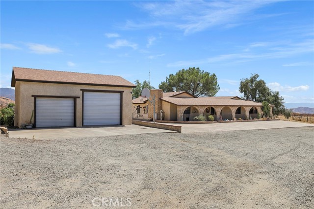32569 Cidar Avenue Agua Dulce, California Stunning Agua Dulce single story ranch home complete with large detached garage and a Barnmaster dual door/center breezeway 8 stall barn. Four bedrooms and two baths, at just over 2300 sq ft, you'll find no other home quite like it. Oversized fireplace in living room. Wet bar too! Cute kitchen off living room. Amazing panoramic sunset views. Large covered front porch. Quiet and very private. Plenty of flat areas to park all your vehicles and horse trailers. Large flat area for a horse arena or even a possible ADU? Endless possibilities. Although this property is located in beautiful Agua Dulce, its also close to Canyon Country and Saugus. Just a few short minutes south and you'll find all needed amenities and local shopping and restaurants. Metro link station available in Saugus for commutes to downtown Los Angels. This ranch estate is also off paved roads. Large solar production too! Dual HVAC units! Amazing mature cactus on property. Come for a visit. Stay for a lifetime. Welcome Home!
