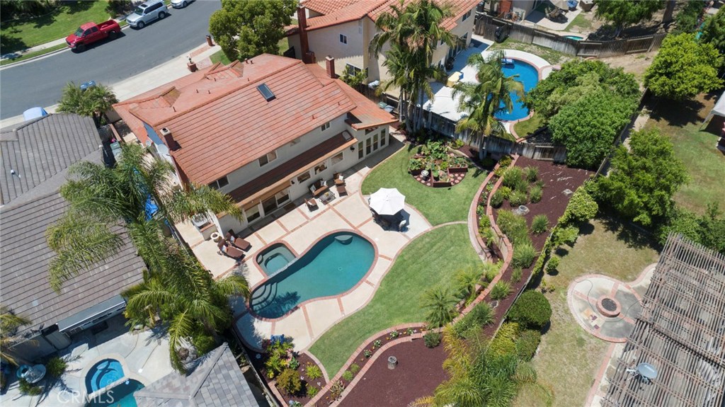An Entertainers Dream! At appx 2706 sqft, this beautiful Lake Forest pool home sits on an appx 9100 sqft cul-de-sac lot.Double door entry is through your privately gated court yard.Enter into soaring ceilings, formal living room w fireplace, formal dining room w french doors to the back yard.Large family room w built in entertainment center, LED lights, cozy fireplace and granite counter wet bar.Lg gourmet kitchen w  custom cabinets, massive granite eat at island and workspace, stainless gourmet Thermador Professional stove,stainless GE double Oven, Built in Sub-Zero refrigerator and 145 bottle wine refrigerator.Stainless microwave, trash compactor, dishwasher and sink. Downstairs bedroom w ceiling fan, closet organizers & mirrored wardrobe doors,remodeled downstairs bath w pedestal sink, custom tile & shower w glass enclosure, large secondary bedrooms upstairs w ceiling fans & mirrored wardrobe doors. Large master suite w vaulted ceiling, ceiling fan.LG mstr bath w dual vanity’s w granite counter, jacuzzi tub custom flooring & shower.Huge walk-in closet w organizers.A very private entertainers back yard w beautiful pool & Spa, large patio, lush landscaping & Lg grassy area. 3 car garage w built in office. This home has it all! New carpet, new paint, stone flooring, custom gourmet kitchen,bed & bath down, pool&spa, private back yard, 3 car garage & cul de sac location! HOA w 2 pools, tennis courts and clubhouse!