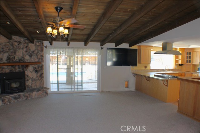 Large wood burning fireplace in family room for toasty winter evenings.