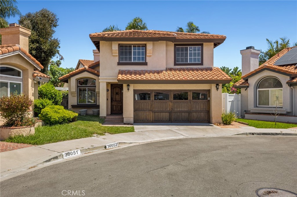30052 Corsair Laguna Niguel, California Remodeled.. Santa Barbara architectural style home. Gourmet kitchen features Calacatta White Marble, Viking Range dishwasher & refrigerator. Main level has great room with exposed wood beams & corbels and custom fireplace surround. Kitchen with dining nook, wet bar, custom wine closet, powder bath, custom wood pantries. Viga beams in ceiling. Upstairs features primary bedroom, en suite bathroom with double sink, marble countertops & waterjet mosaic marble floor. White Oak 9" wide plank hardwood flooring & custom built in closets in all 3 bedrooms. Wrought Iron stair railing and painted Saltillo tile flooring. Garage finished with designer epoxy floor coating & custom wood stained garage doors. This stunning home sits at the end of a Cul-de-sac. Designer touches throughout.