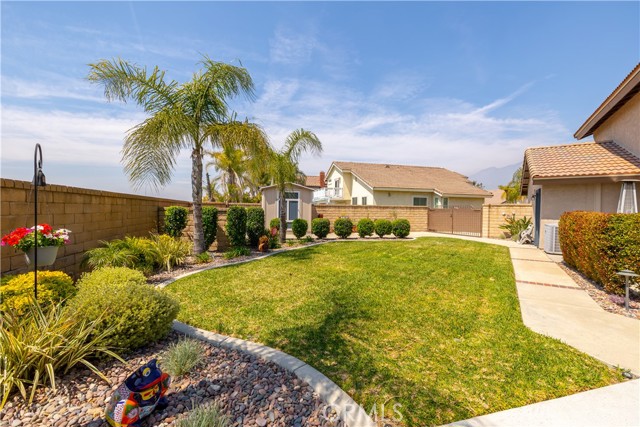 Side yard south with nice grassy area.