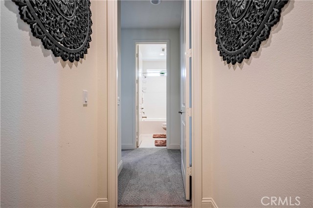 Second bedroom is another primary en-suite. Bathroom with tub/shower is in the front of this primary bedroom. Burbor carpet is lush and upgraded.