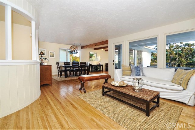 The living room flows into the dining room and family room.