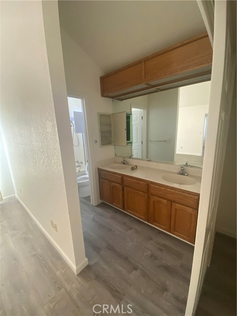 Primary vanity area has dual sinks.