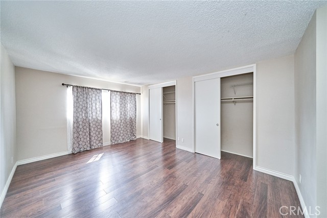 Primary Bedroom with flowing natural light and ample closet space.