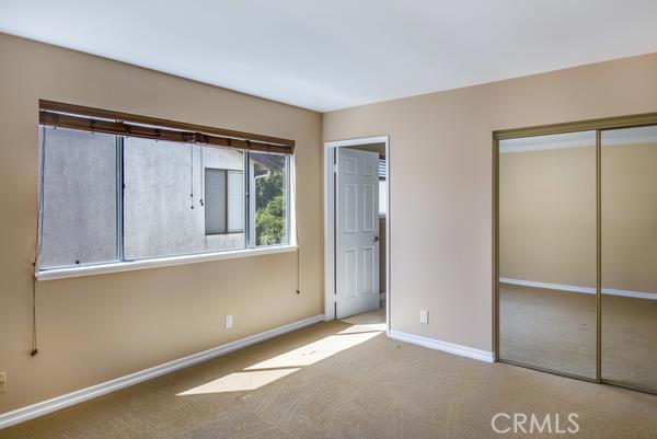 This bedroom is at the end of the hallway upstairs. There are three bedrooms on the top level all with in-suite baths.  This room has a full bath attached.