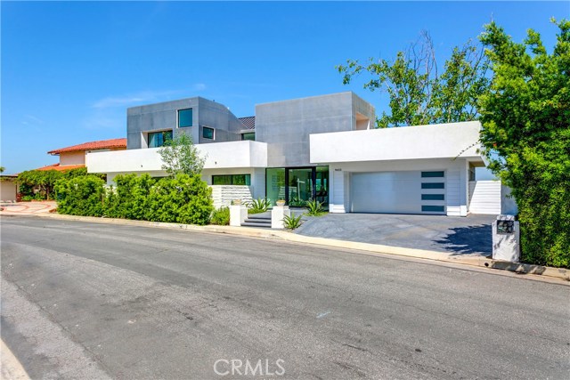9653 Highridge Drive Beverly Hills, California Stunning modern build perfectly situated with luscious canyon views will have you vacationing at home!!! This beautiful spread has floor to ceiling windows throughout and plenty of natural lighting to compliment the open-airy floor plan. Gourmet kitchen with state of the art appliances. Multiple patios/terraces wraps the home beautifully including a 3rd floor master suite featuring a rooftop patio with an unobstructed canyon view perfect for entertainment or early bird workout and yoga sessions. New build and stylish furnishings!! Move-in ready!!!