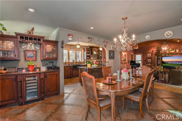 Dining area with custom bar and wine refrigerator