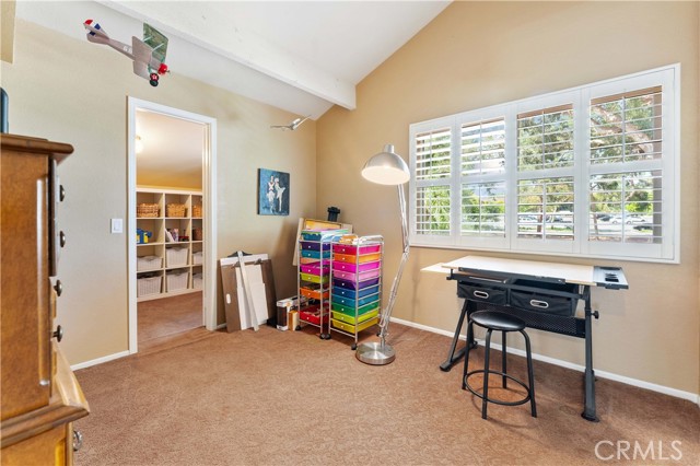 One out of four bedrooms with charming walk in closet. Currently used as an artist's room. Double pane window. Set next to shared upper full bathroom.