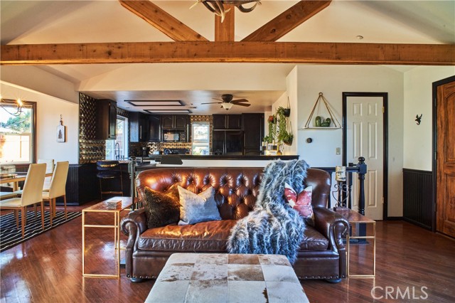 Expansive living room with exposed wooden beams