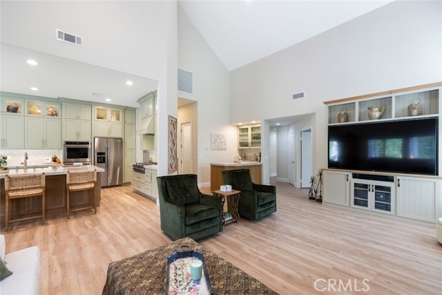 With this open floor concept you will never feel boxed in. The soaring ceilings make this spacious living area feel even more grand and spacious.