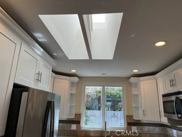 Kitchen has a skylight to let in the light all day.