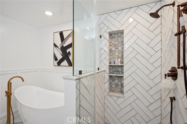 Harringbone tile shower-primary bath