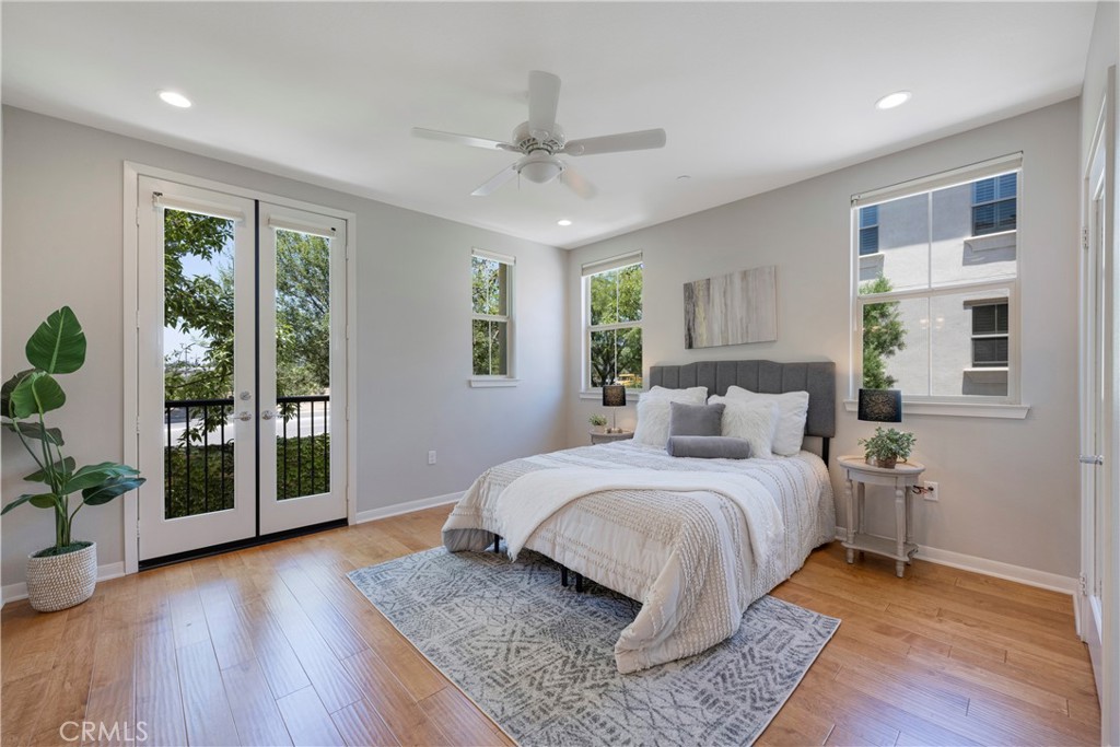 Master Bedroom has a Juliet Balcony, Real Hardwood Flooring, LED Recessed Lighting, Ceiling Fan, and Dual Paned Windows!