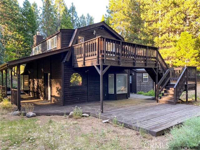 Beautiful private sanctuary, nestled on 2.5 serene acres just outside Mt. Shasta, CA. This 2 unit property meets the requirements to apply for a short term rental license in Siskiyou County. The property features nearly 2000 sq.ft. main home and a comfortable 700 sq.ft. one bedroom guest house above a large oversized garage. In the main home, the family area is situated upstairs adorned by many windows allowing natural light and fabulous forest views. Stunning knotty pine ceilings and walls and wood stove, give this a sense of coziness, yet there is plenty of room for entertaining large gatherings. Kitchen opens to a deck overlooking the land and a perfect place to view the starry night skies. Downstairs, each bedroom brings you closer to nature, adorned with bay windows with inviting window seating. The expansive primary bedroom features an ensuite bathroom. Step outside one of several decks provided around the property, where you can savor your morning coffee surrounded by the sights and sounds of the outdoors. The entire property is fenced with a delightful paved quarter mile walking path with giant old growth trees watching over along the way. The guest house sits above the garage; a full 700 sq.ft. one bedroom apartment with kitchenette, bathroom, and large living room that extends out onto the deck. An ideal location to watch sunsets in the summer and snow fall in the winter. Below the guest house you have access to the insulated and finished garage and hobby room. This area has hookup for guest washer and dryer. The overall feeling of the property is forested, with evergreens and other deciduous trees, plus a large variety of fruit trees. The water is the best you might ever taste and the soil is great for gardening. There is a small meadow like area and native wild flowers grow throughout. This is nature at its best. In Mount Shasta there is much opportunity for recreation and good eating. The Mount Shasta Resort is only a short distance from this property. There you can golf, play tennis, or have a bite to eat in the restaurant. The Lake Siskiyou Resort and recreation area is only a bit further which leads way to other mountain lakes and great hiking. The Mount Shasta Ski Resort is less than 11 miles away. Visit the beautiful town of Mount Shasta for wonderful shops and great restaurants! Whether a vacation home or your primary residence, you will love all the area has to offer!