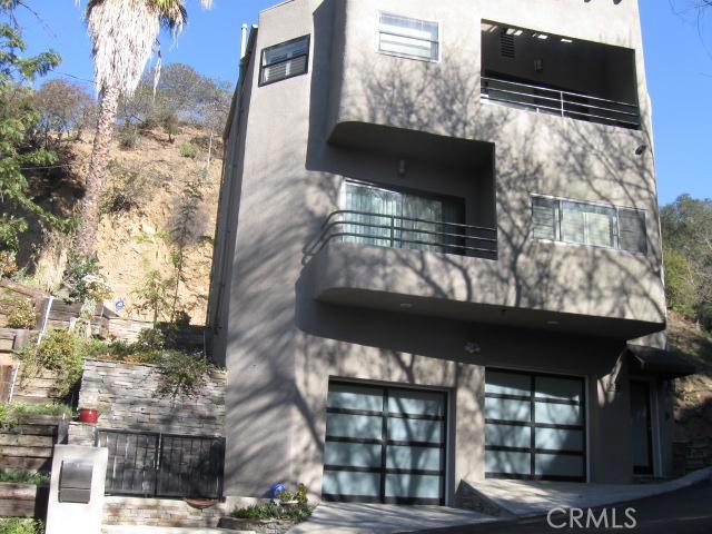 2625 La Cuesta Drive Los Angeles, California Ultra Chic Pied-A-Terre Nestled In Hollywood Hills/ NICHOLS CANYON With Beautiful Canyon/City Lights Views. PROPERTY HAS ELEVATOR FROM GARAGE TO TOP FLOOR. Impeccably Furnished And Decorated. This Spacious One Bedroom/1.5 Bath, Two-Story FURNISHED HOME Offers All The Amenities And Luxuries One Could Ask. Gorgeous Living Area W/Beautiful Hardwood Flooring Thru-out, Gourmet Kitchen W/Custom Cabinetry and Stainless Steel Appliances, Breakfast Nook, Formal Dining Area, Spacious Master Suite w/ Office Area/Nook. Ample Closet Space Thru-out, Master Bathroom Offers Custom Tile/Glass/Separate Shower Tub. Two Large Balconies To Enjoy The City Lights And Canyon Views. Two-Car-Garage And Bonus Area Provide Extra Space For Storage And Laundry Facilities. Very Private And Secure W/Alarm System. Just A Few Minutes Away From Sunset Blvd. OR Studio City . . . No Need To Preview. TURNKEY!
