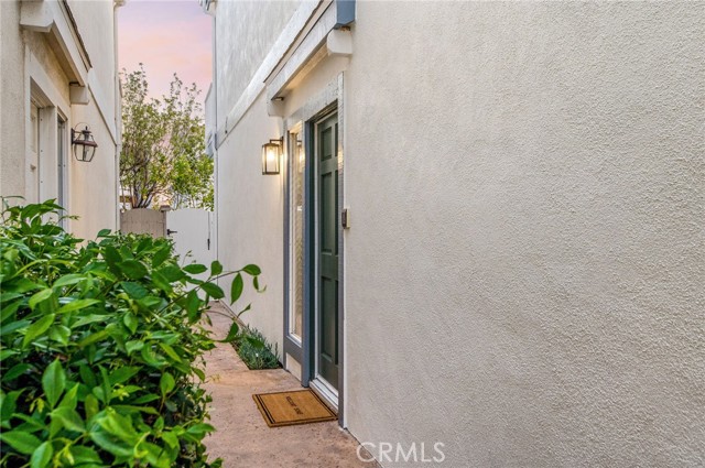 The rich green front door welcomes all visitors.