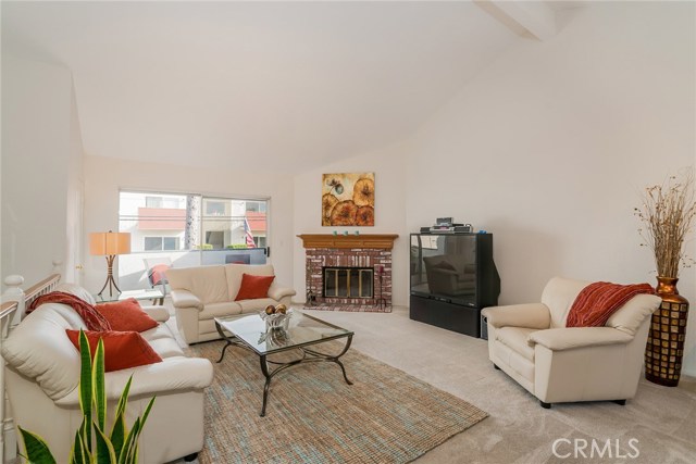 Living Room w/ fireplace & slider to deck