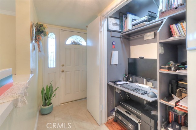 Entry way and the entry closet is currently being used as an office.