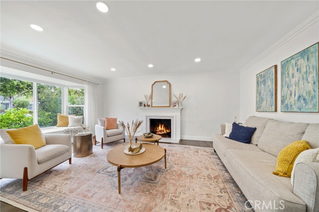 Formal living room with views of the lush front yard