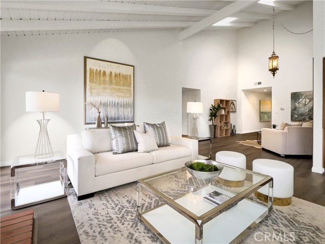 The living room with high ceilings add spaciousness to the great home.