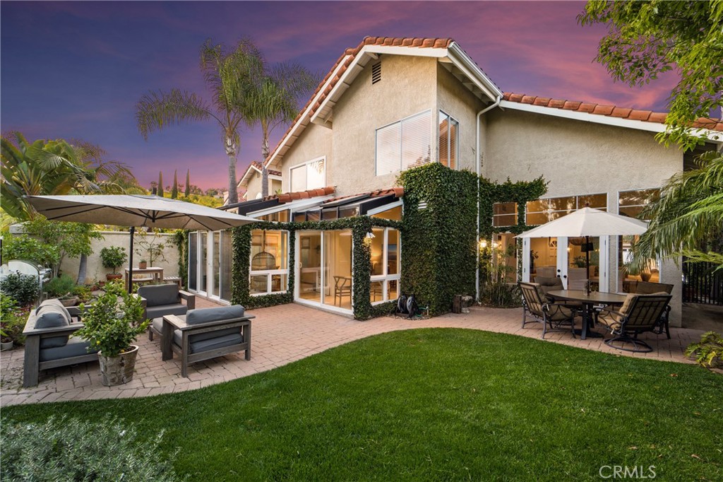 Don't miss this exceptional home in Laguna Niguel's highly sought-after Westerlies! Boasting 4 bedrooms plus an office (teen room), with one bedroom located downstairs, this home has been thoughtfully expanded to maximize space and comfort. Three full bathroom remodels feature modern updates, while the primary bedroom includes two closets, one a walk-in, for ample storage. The beautifully remodeled kitchen features modern finishes, floating shelving, subway tile backsplash, and high-end appliances for all your culinary adventures. The dining room has a newly installed chandelier.  Plus, new window treatments and ceiling fans have been added, and the 3 car garage features convenient storage options. Enjoy the gorgeous wood flooring and renovated staircase throughout the home, with updated plumbing thanks to a full PEX repipe. New AC installed in 2015. The beautifully manicured front and backyard provide the perfect space for outdoor entertaining, gardening, or relaxation.This home is located near walking and biking trails to Monarch Beach, parks, Blue Ribbon schools, and shopping. Don't miss out on this opportunity to own an exceptional home in Laguna Niguel!