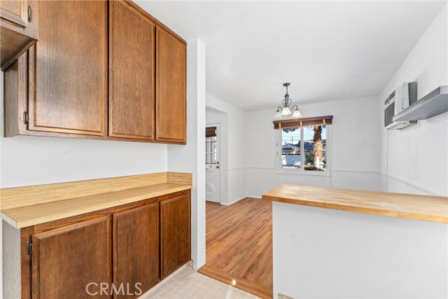 Galley kitchen showing ample cabinetry