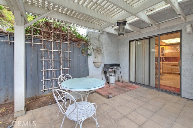 Easy Access Covered Patio From Kitchen & Dining Room.  Decorative Paver Tile Flooring