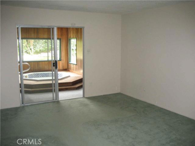 Main floor master bedroom leading to spa room