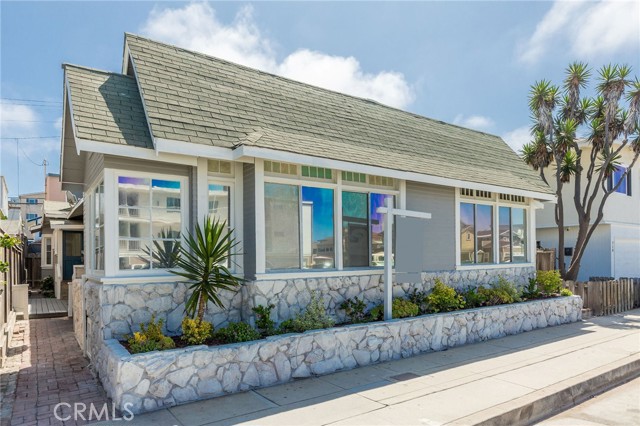 Your Flex-Use Vintage California Beach Cottage awaits!  Freshly painted inside and out, with new flooring, ceiling fans, lighting and landscaping, an inviting, beachy character shines through.  Classic charm like this simply can’t be replicated in newer buildings, and there’s a further value-add opportunity by upgrading the kitchens and bathrooms. As a duplex, this property provides many flexible and versatile use options.  1) Hold it as a legacy investment property to build generational wealth as the current owners have.  2) Live in one of the units and rent out the other for income - the rent will offset about $900k of your mortgage, making it a compelling effective net purchase of $1.6m.  3) Use it as a fun vacation home or vacation rental where the side-by-side units provide co-living for extended family/kids in their own private spaces.  4)  Set your children up to live in a family-owned property while they attend college or start their professional life, then retain for investment or build your dream home.  5) Develop a beautiful new 4,400+ sf 3 story home with rental unit that would be worth approx. $5.7m in today’s market.  Positioned on a coveted west-facing 40’ extra-wide lot, each unit has some outdoor space to enjoy the glorious weather and sunshine.  It’s all about life by the beach here.  This is a fun and active, car-optional location, ideal for beachgoers who love being in the mix and close to Pier Plaza’s restaurants and shops, The Strand, and summer beach concerts.  Hermosa’s pristine wide sandy beach is just 8 doors away and is the favored training ground of pro beach volleyball players.