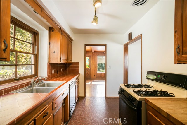 Kitchen adjacent to the living room and dining room