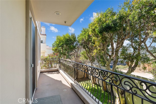 Lower level balcony with access to main bedroom and private outdoor space.  Ocean views from lower level.