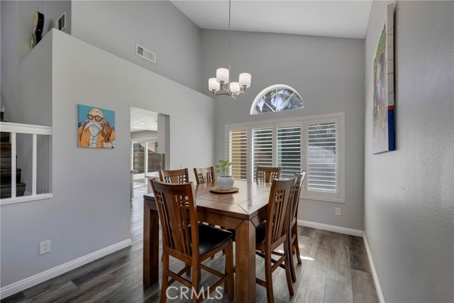 DINING ROOM, OFF KITCHEN, WITH EXPANSIVE CEILINGS.