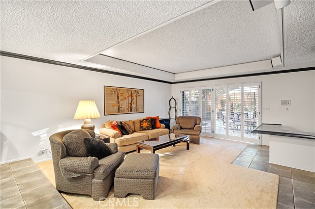 The family room features a beautiful fireplace, wet bar and access to the beautiful backyard.