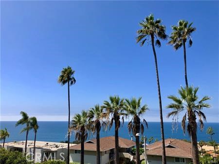 21651 Ocean Vista Drive 11 Laguna Beach, California Stunning Ocean View Condo. This absolutely stunning front row unit in the prestigious "Aliso Laguna" complex with no unit above or below. This breathtaking completely FURNISHED home boasts an unbeatable location within moments of several gorgeous beaches such as "Aliso Creek," "Victoria Beach," and the PUBLIC PARK of the MONTAGE RESORT. The spacious open living room floor plan features a designer kitchen with custom cabinets, quartz countertops, and a Carrara marble backsplash. Find serenity throughout the many finishes including a stone fireplace with custom mantel, large plank wood floors, and a custom wrought iron staircase. The Master bedroom features cathedral ceilings, a private view deck, large walk-in closet, an additional mirrored closet, and breath taking ocean views. The master bath has dual vanities with marble counter tops, glass shower and large soaking tub. The secondary bedroom also has stunning ocean views, and a large closet. Excellent ocean views from all levels of the property, decks on both levels, as well as a slider out to the patio in front. A gated community with subterranean parking space with storage AND a ROOF TOP POOL with amazing views of the coast. ENJOY STEPS to the nearby shopping center as well as the renowned Montage Resort & Spa, "THE RANCH" GOLF COURSE, beaches, shops, restaurants and grocery store.