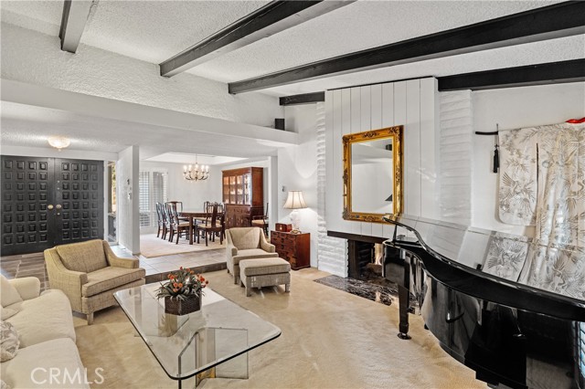 The vaulted ceilings and dramatic fireplace welcomes you in the living room.