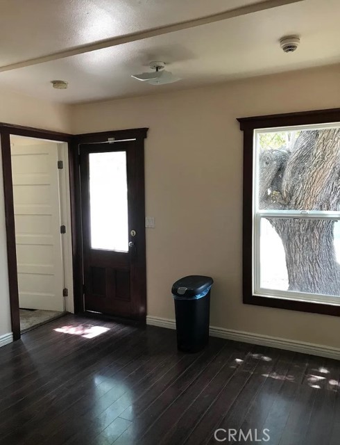 Eat in kitchen area with door to backyard.  Door on right is to the primary suite.