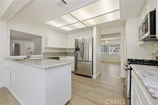 Kitchen wiht Quartz Countertops and Stainless Appliances