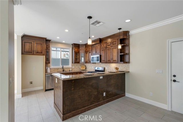 Kitchen features recessed lights.