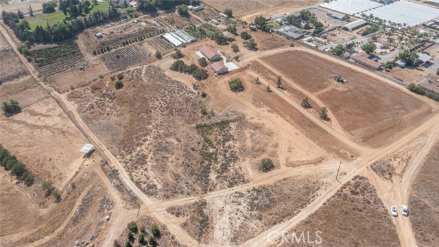 17850 Palm Road Riverside, California This is a wonderful property with endless opportunities to make this your perfect home, investment, business or more! At the top of the property you have a beautiful view of Lake Mathews and almost everywhere on the property a stunning Riverside skyline view. This single story, low-tax home has been meticulously maintained and ready for immediate move-in! The main house has 3 bedrooms, 2 baths with fresh paint, multiple living areas, new septic installed in 2020, brand new concrete on the patio and the new sidewalk and garage driveway, new water heater for the house and brand new energy efficient windows installed in 2021. Neutral white paint throughout, newer carpet, and window treatments on almost every window for privacy.
Interior laundry room with plenty of storage and natural light. There's a detached 4 car garage with a full bathroom, small utility or office room, and it's extra-deep for storage with a rough-finish on the drywall. The garage COULD be used as an ADU with proper investigations and due diligence. The property has new fencing posts as you're entering and a freshly graded dirt driveway and is about half way fenced around the entire private 10 acres. There are beautiful 100-200 year old Juniper trees and plenty of flat usable land, slight-grade land as well as opportunity for whatever your wishes may be! Current zoning shows A-2 which allows for single family residential and agriculture in nature including cultivation of crops, raising of animals and commercial agriculture purposes.