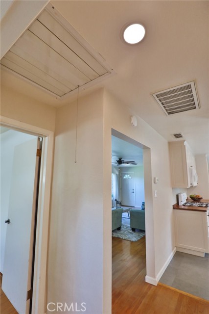 The hall ceiling has a whole house fan.