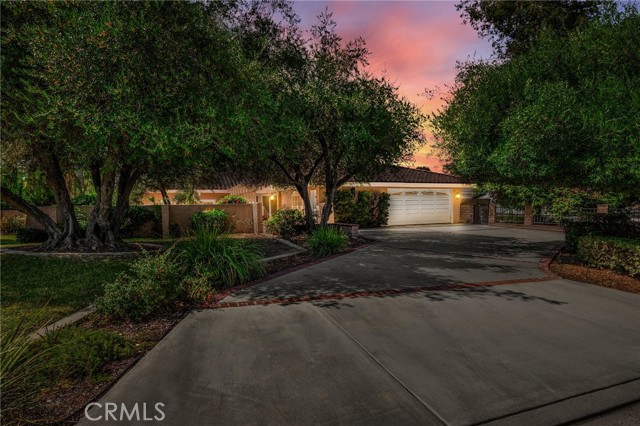 THIS HOME IS A MUST SEE! CUSTOM SINGLE STORY HOME in a highly sought-after Fullerton neighborhood! This home features a bright and open floorplan with 4 bedrooms, 4 bathrooms with 3,884 square feet of spacious living space on an 23,125 sq foot lot! This floor plan features a large living room at the entry that includes a large, cozy fireplace, beautiful wood flooring, recessed lighting, and has a beautiful view of the large courtyard that provides plenty of natural lighting. The spacious family room features a large brick fireplace, wet bar with seating, direct access to your own wine cellar and has beautiful views of the beautiful backyard. The beautifully designed kitchen features plenty of custom cabinetry for storage, double ovens, warming drawer, built in electric cooktop and range hood, kitchen island with sink and storage, pantry, and breakfast nook with view of the sparkling pool. LARGE formal dining room which makes it great for entertaining! Beautiful, main bedroom suite features LARGE bedroom area with brick fireplace, TWO walk-in closets-with wall safe, vaulted ceiling, and has beautiful views of the backyard. The beautiful main bathroom includes a mirrored closet and cabinetry for storage, beautiful double sink vanity with custom lighting, large soaking tub, and private sauna. Down the hall are two spacious Jack and Jill bedrooms, a beautiful hall bathroom that features a double sink vanity, beautifully tiled walk-in shower and direct access to the pool area.  The fourth bedroom is next to the garage and has its own private access, a large window for natural lighting and has cabinetry for storage, sink and small refrigerator. This private backyard is SPECTACULAR AND IS MADE FOR ENTERTAINING!!! The backyard features a BEAUTIFUL sparkling pool and spa, expansive covered patio area, gazebo, mature landscaping, RV Parking with gate access and large grassy area with fruit trees. Additional features of the home include 2 car garage epoxy flooring, long driveway for additional parking, tile roof, Home automated lighting, updated plumbing with PEX piping, and 2 water heaters. Conveniently located close to Fullerton Loop, Hiltscher Park, Equestrian trails, hiking trails, restaurants, shopping, St Jude Medical Center and close to CSUF. Award Winning Schools: Sunny Hills High School, Parks Middle School and Laguna Road Elementary. Welcome home!