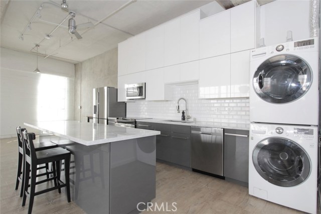 1855 INDUSTRIAL Street 419 Los Angeles, California Light and Bright Corner unit with Balcony and Panoramic View of Art District in DTLA. One of the Best Corner Unit Location in 121 Toy Factory Loft units. Charming, Temporary Style for Urban Living, High Ceiling, Surrounding Windows, Wood floor, Upgraded 2 baths, High-end Kitchen Cabinetry with Island and so much more. Semi-Enclosed Bedroom with Imported Custom Shade Curtains and Wall Closets. Refrigerator, Washer, Dryer included. Tenant have option to rent Storage space at $50 per month. Unit comes with 1 reserved gated parking spot #74. HOA Amenities included 24/7 Front Desk Security, Fitness Center, Outdoor Garden on 3rd Floor, Fireplace, BBQ’s, Resort Style Rooftop Pool, Firepit, Cabana with Stunning 360 degree DTLA View. Monthly lease includes Electricity, Water, Gas, Trash and use of all HOA Amenities. Electric Car Charging Station available across the street. Unit is available for immediate move-in.