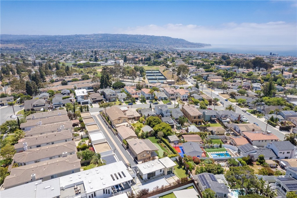 PRICE REDUCED.!!! ***MOTIVATED SELLER.****!
 GREAT OPPORTUNITY TO OWN THE ONE LARGEST BEAUTIFUL HOUSE IN SOUTH REDONDO BEACH.
*******Link for 3D Virtual Tour*** https://my.matterport.com/show/?m=owpjNEV6etZ
 Situated on a huge 12,000 SF lot, this captivating home is located on top of a hill on a quiet tree-lined street in South Redondo Beach. 
The 4,856 SF/ 6 bedroom, 6.5 bath main house features an open floor plan, sun-filled rooms, and luxury finishes. Upon entry you will be taken by a grandiose 18' high ceiling and marble floor entryway that opens to a beautiful sunken living room, complete with a limestone fireplace. Next to the formal dining room is an open concept lounge furnished with a full beverage bar that connects to the family room towards the back with a second fireplace. The chef’s kitchen is equipped with a 48" Subzero refrigerator, 6-burner Wolf range, double oven, a spacious walk-in pantry, and a large granite counter island ideal for dining. Relax in the master bedroom with partial ocean views, a walk-in closet, a spa-like bath that provides a Zen experience, and a private 500+ SF terrace with a spiral staircase leading out to the backyard, revealing a cover deck with a built-in outdoor BBQ/bar area. Off of the 4-car garage that can be split into a home gym, outdoor lovers can relish in the spacious turfed backyard with a fire pit and miniature golf course that delivers spectacular ocean and city views. A detached 756 SF 1 bed, 1 bath and full kitchen guest house (newly constructed in 2018) is the perfect addition for multigenerational families, weekend guests, and entertainers alike.
Situated at the end of a private alley driveway is additional parking for your 30’ RV or boat, secured with an automatic gate.
 This home is loaded with all the amenities to make your life full and to enjoy the South Bay lifestyle.

     *******Link for 3D Virtual Tour*** https://my.matterport.com/show/?m=owpjNEV6etZ