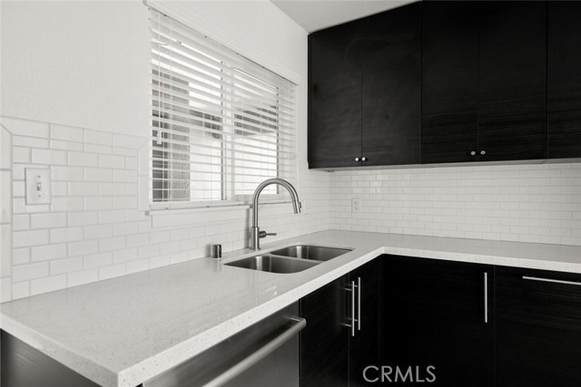 Kitchen At Sink Looking Out To Front Entry