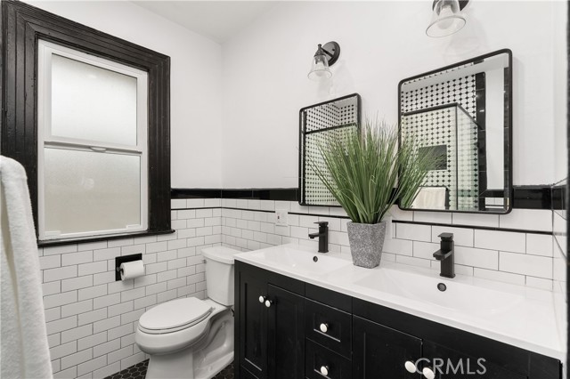 The hall bathroom was just completely updated. It features double sinks and a cool subway tile vibe.