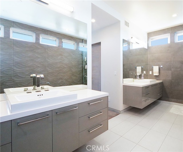 Master bath with floating vanities.
