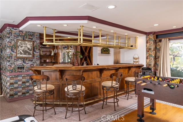 Pub-style bar makes entertaining fun in your game room.