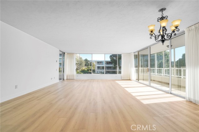 Family room with Wall to floor windows and lots of natural light.